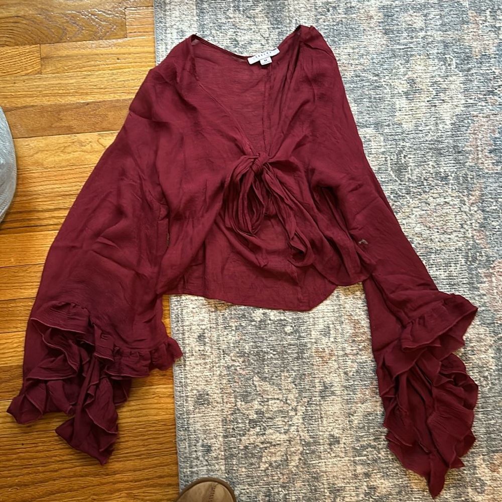 flowy maroon top with fun sleeves